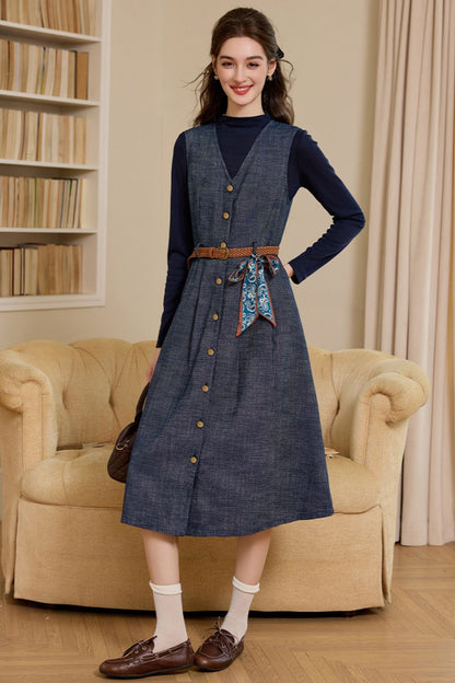 Full front view of button-down denim dress paired with brown shoes and socks