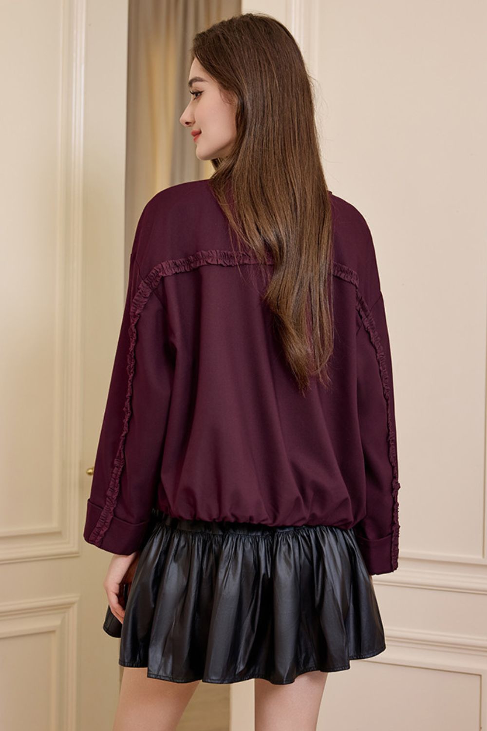 Back view of burgundy jacket showing relaxed fit