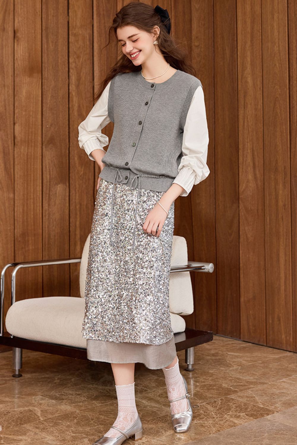 Another view of gray vest outfit with white blouse and floral print skirt