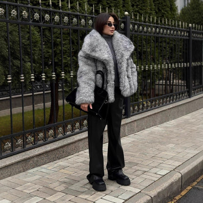 Women luxurious faux fur jacket with voluminous collar